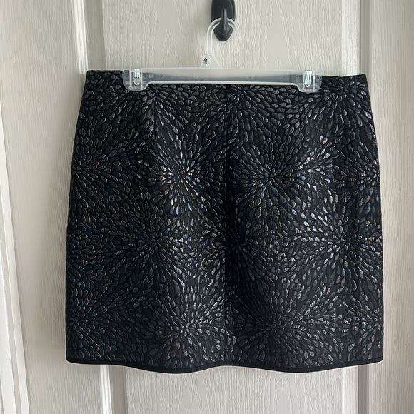 Black with metallic-like thread patterned faux-wrap skirt. Size 12. - Picture 2 of 3